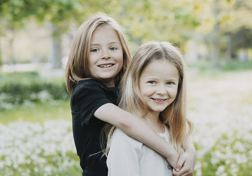 Sisters together for a family portrait in Italy with Etta Images. Italy Family Photographer.