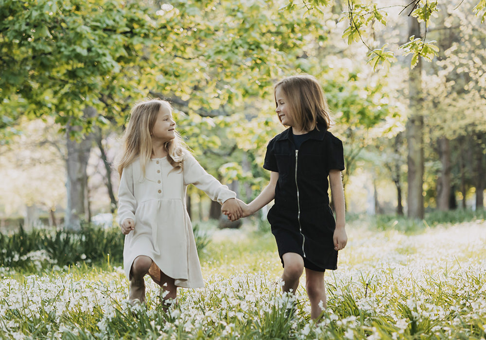 Italy Family Photographer.. Sisters having fun with a family portrait session in Italy