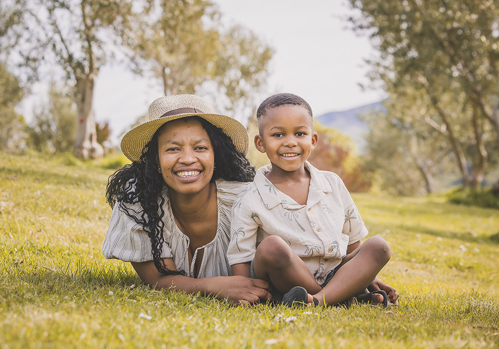 Gorgeous mother and son in Italy having family portraits in an olive grove