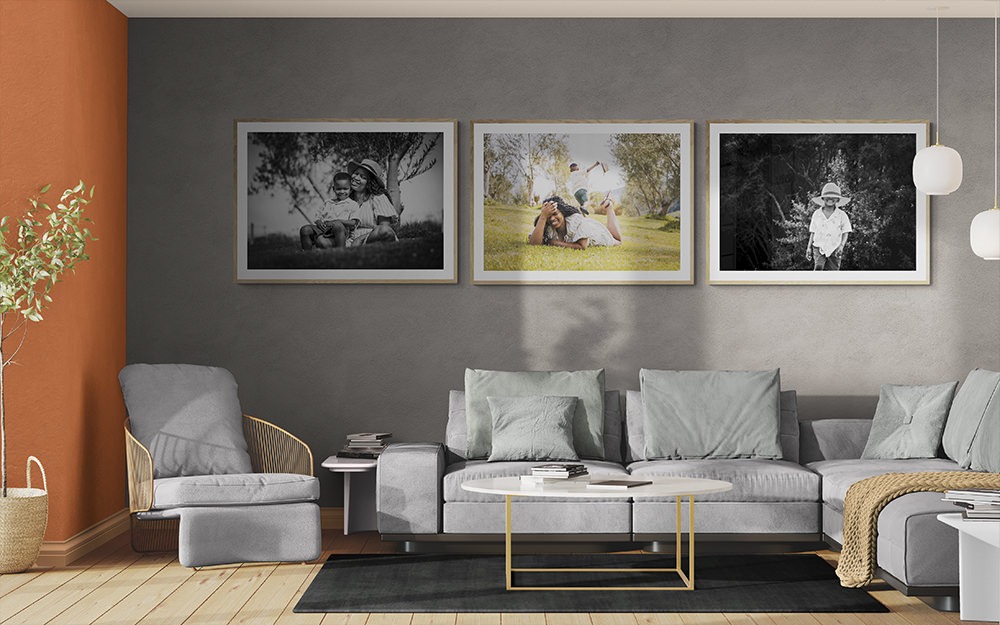 Gorgeous family portraits on a living room wall, perfect for families travelling to Italy 2026