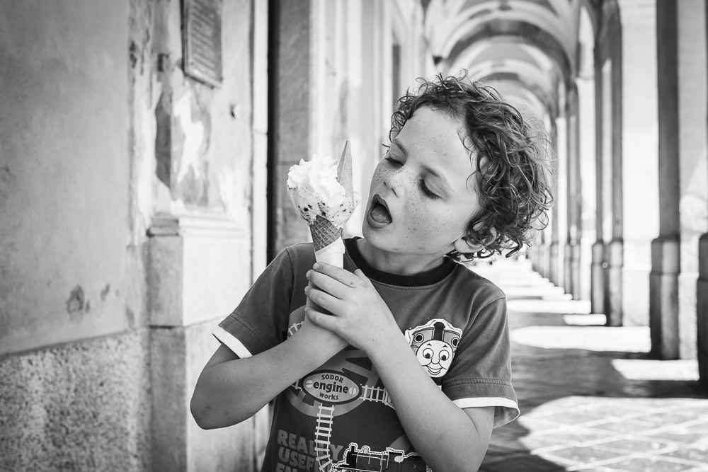 Testing gelato, Italy. Such a fun activity with kids when on holiday in Italy, and makes a great portrait. Etta Images Italy.